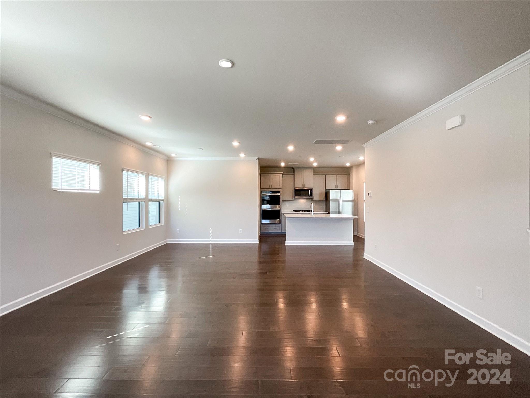 137 Cedar Knoll Circle Pineville, NC 28134 - Photo 6 of 48 a view of kitchen with kitchen island window and wooden floor