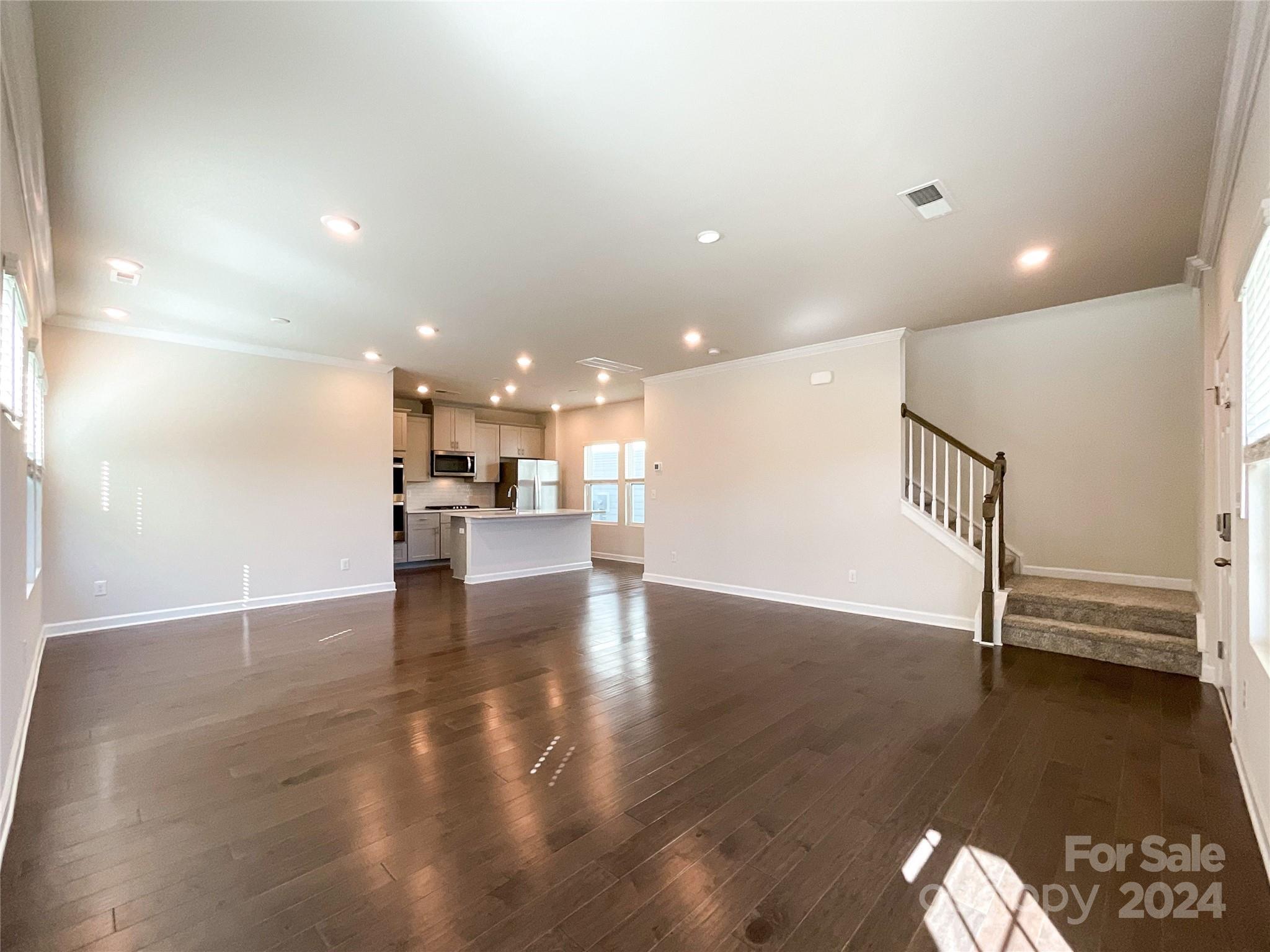 137 Cedar Knoll Circle Pineville, NC 28134 - Photo 7 of 48 a view of kitchen and hall with wooden floor