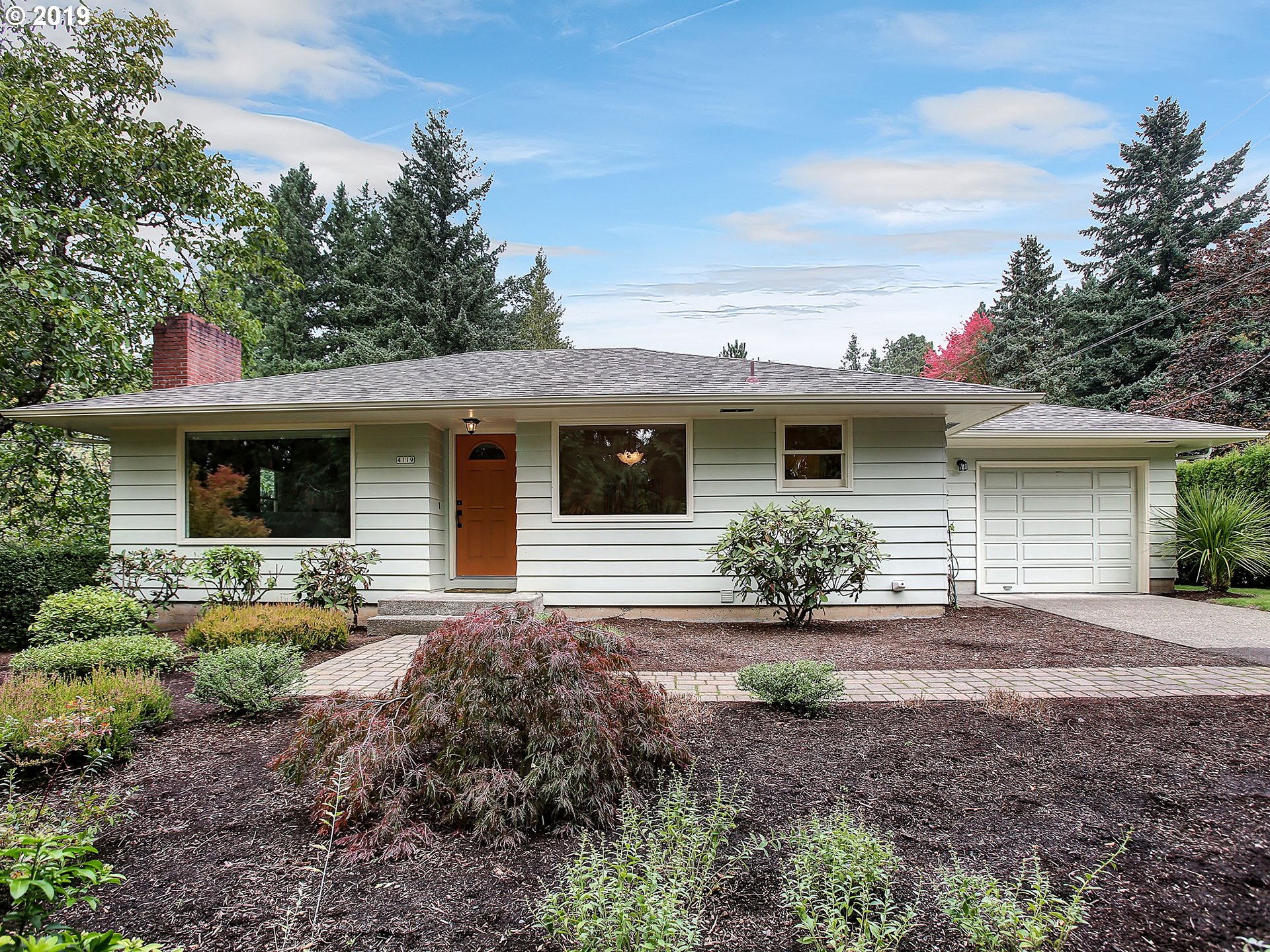 4119 Southwest Hamilton Street Portland, OR 97221 - Photo 1 of 29 a front view of a house with garden