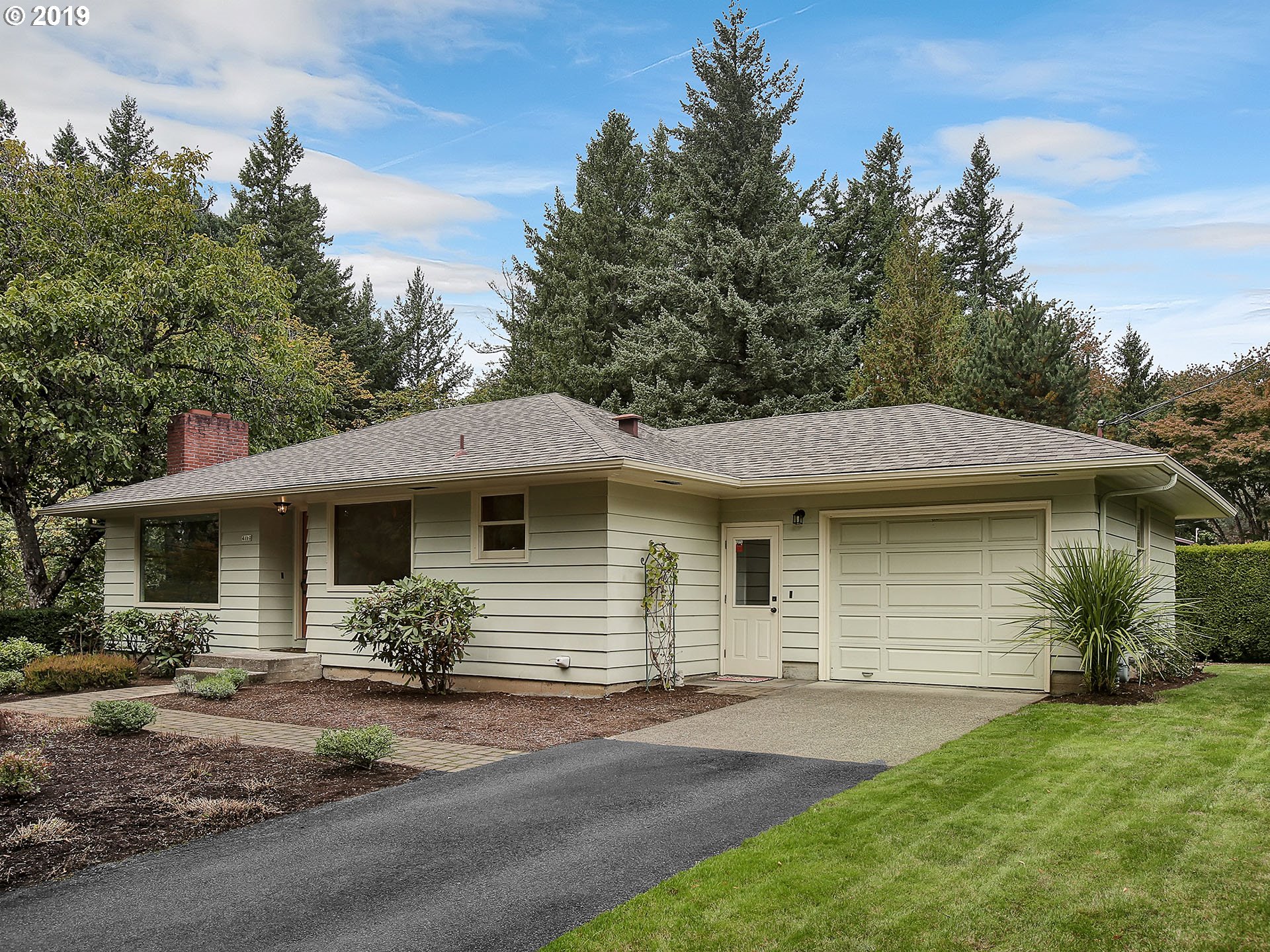 4119 Southwest Hamilton Street Portland, OR 97221 - Photo 2 of 29 a front view of a house with garden