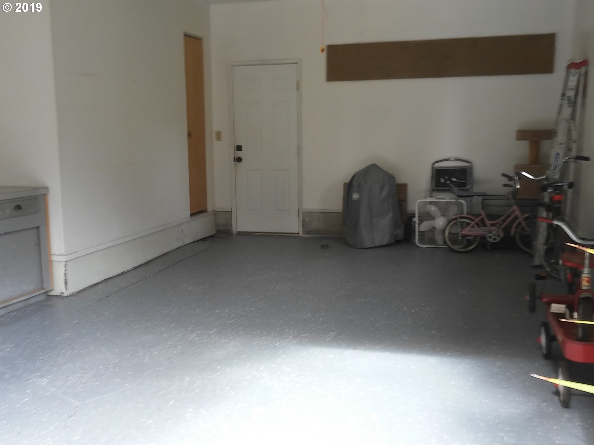 4119 Southwest Hamilton Street Portland, OR 97221 - Photo 23 of 29 a room with a bed and a table