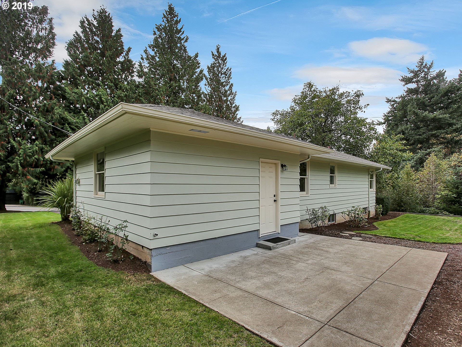 4119 Southwest Hamilton Street Portland, OR 97221 - Photo 24 of 29 a small white house with a outdoor space
