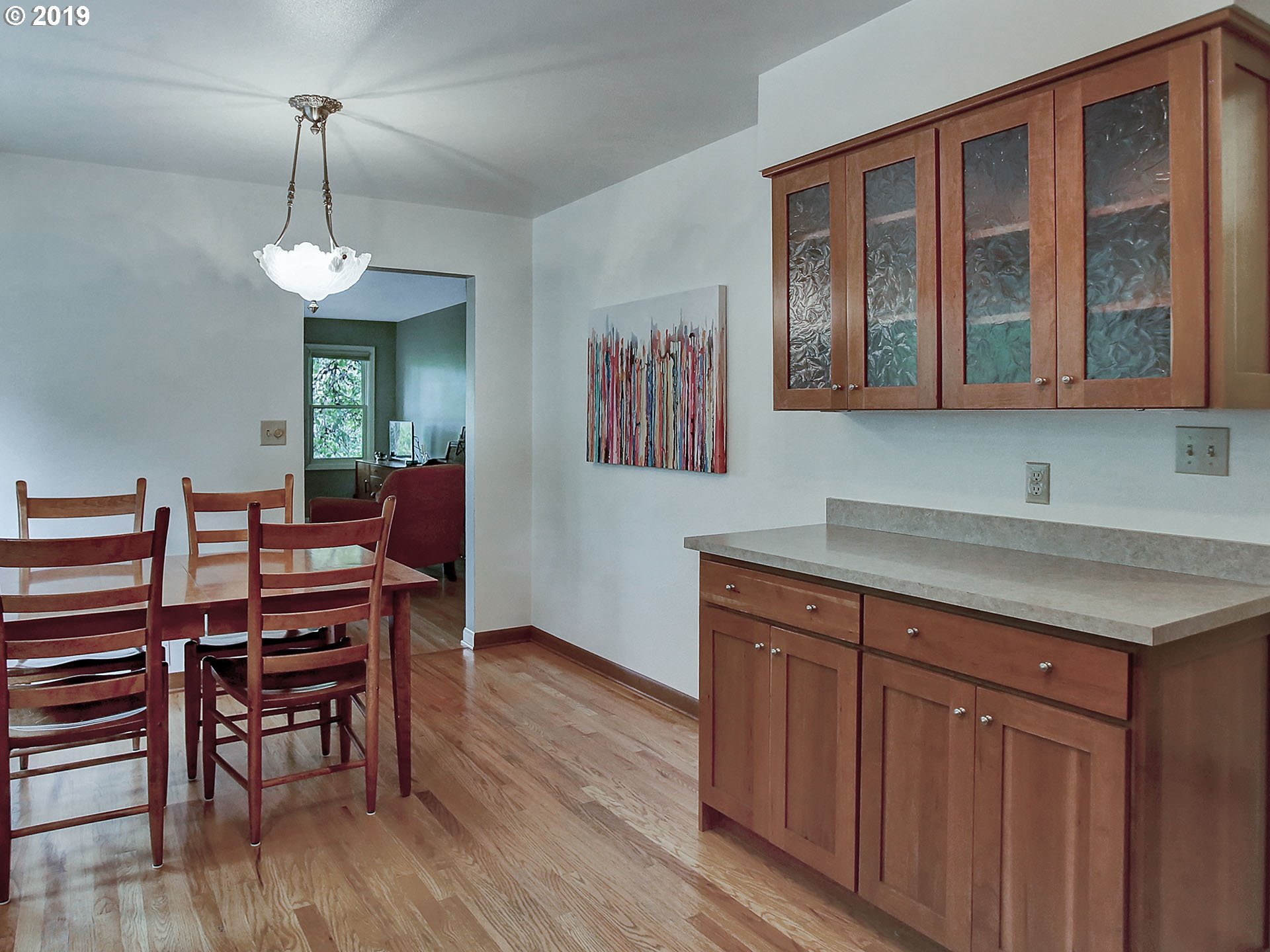 4119 Southwest Hamilton Street Portland, OR 97221 - Photo 7 of 29 a view of a dining room with furniture wooden floor and a chandelier