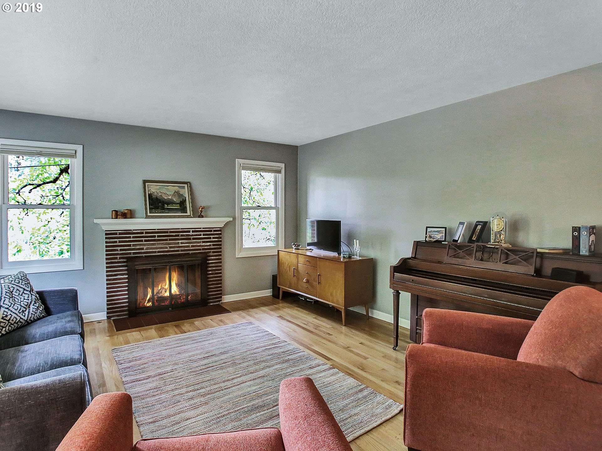 4119 Southwest Hamilton Street Portland, OR 97221 - Photo 9 of 29 a living room with furniture and a fireplace