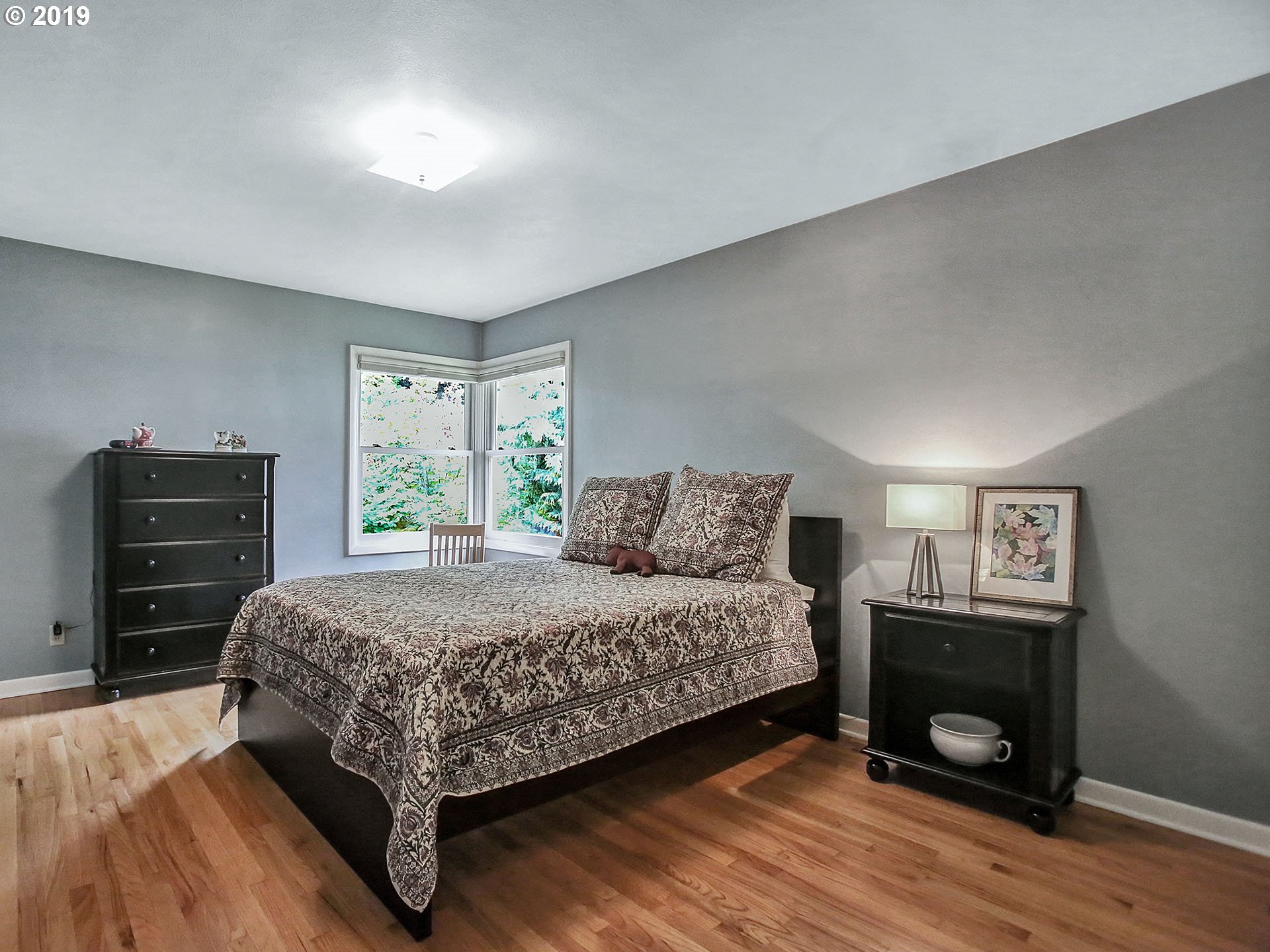 4119 Southwest Hamilton Street Portland, OR 97221 - Photo 10 of 29 a bedroom with a bed and a dresser