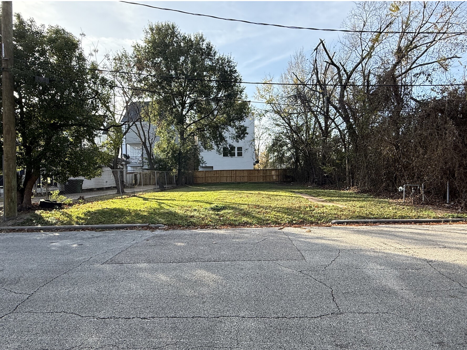 a view of a swimming pool and a yard