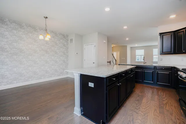 a kitchen with wooden cabinets and a sink