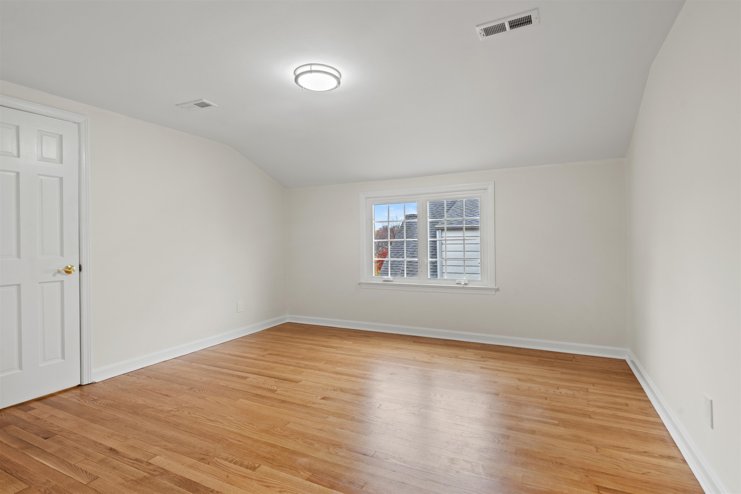 238 Springfield Avenue, Unit 2 Rutherford, NJ 07070 - Photo 11 of 21 wooden floor in an empty room with a window