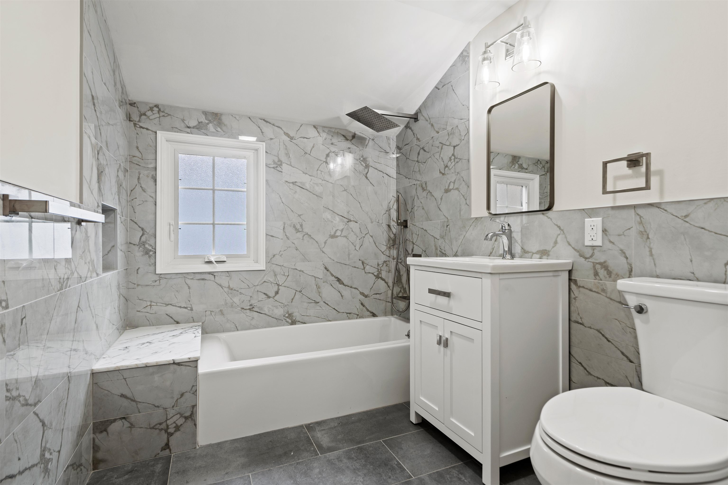 238 Springfield Avenue, Unit 2 Rutherford, NJ 07070 - Photo 13 of 21 a bathroom with a sink toilet vanity and bathtub