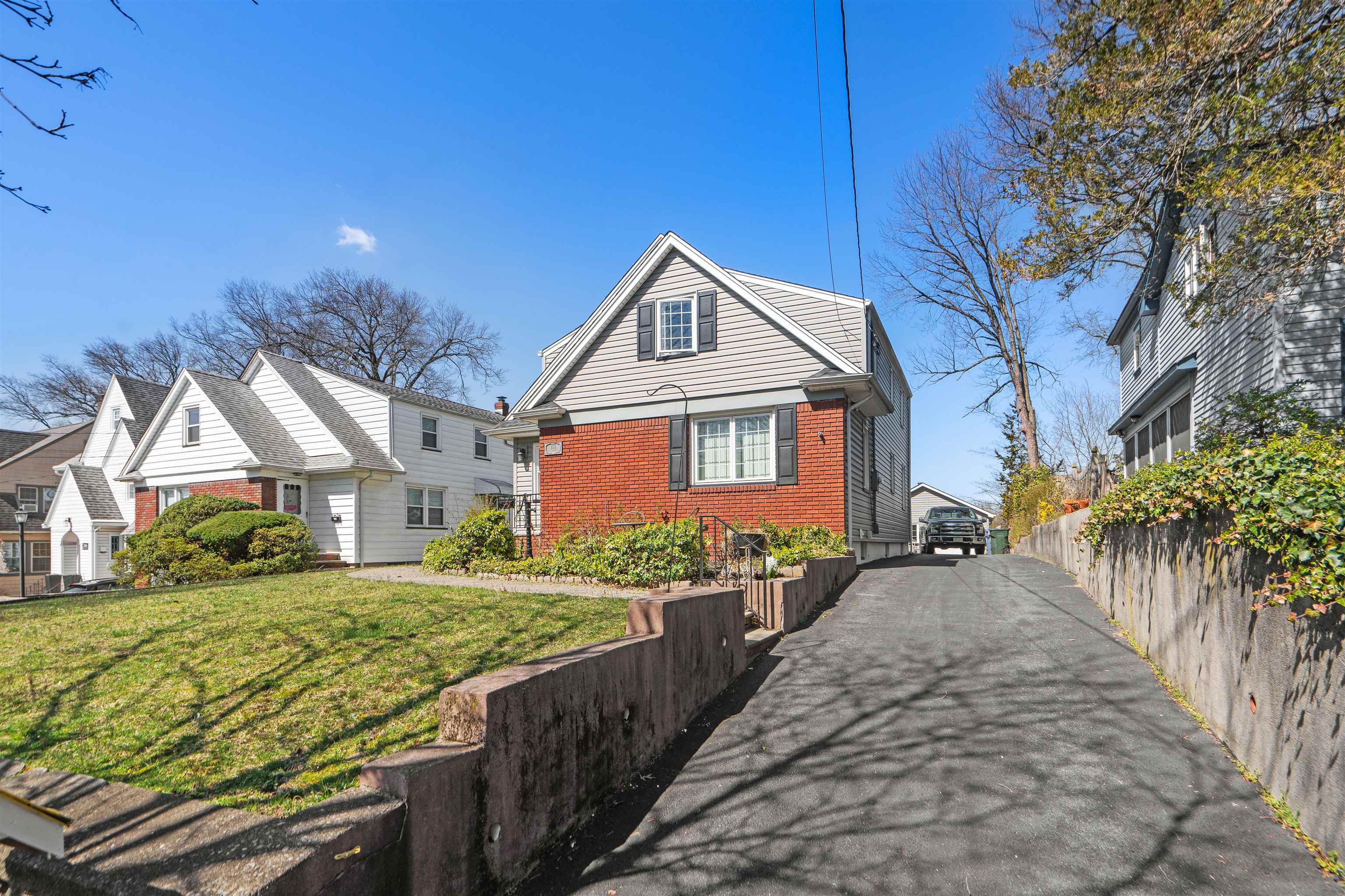 238 Springfield Avenue, Unit 2 Rutherford, NJ 07070 - Photo 14 of 21 a front view of a house with garden