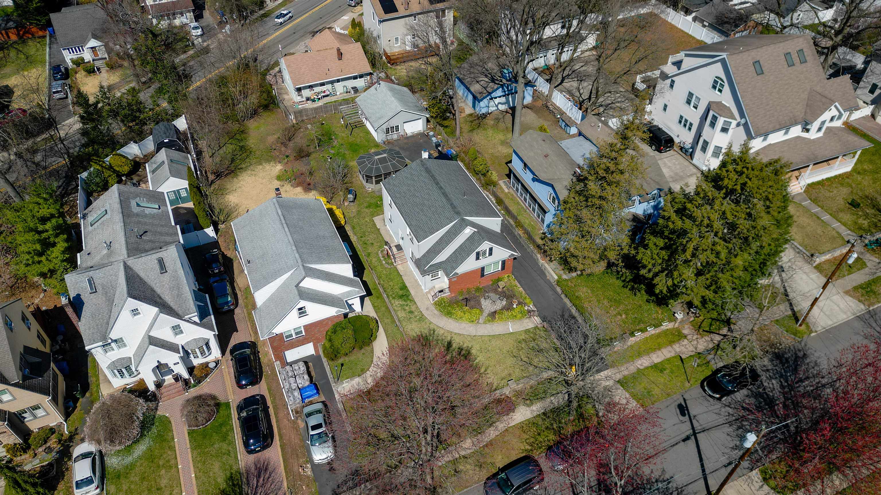 238 Springfield Avenue, Unit 2 Rutherford, NJ 07070 - Photo 18 of 21 an aerial view of a house with a yard and outdoor seating