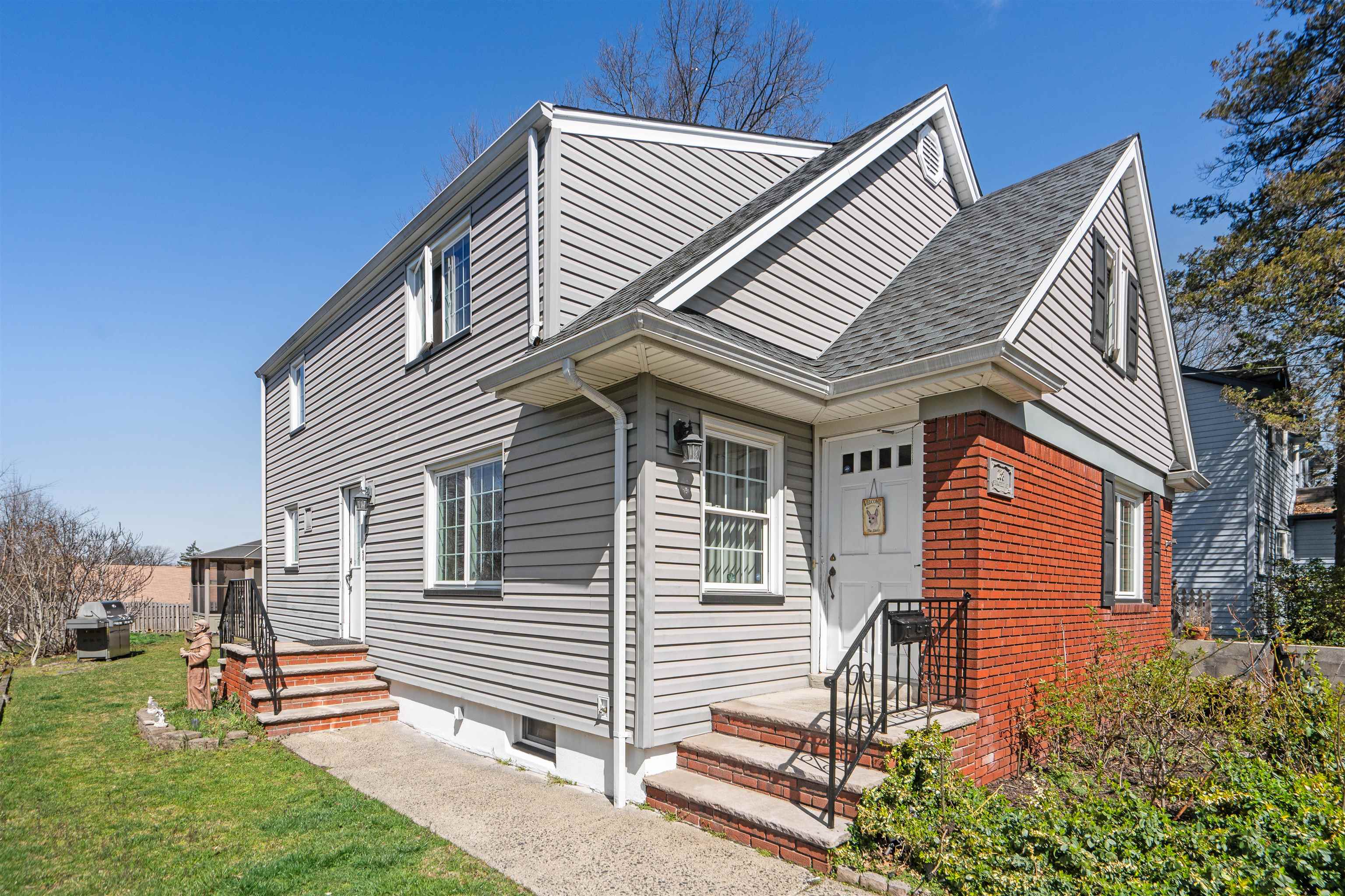 238 Springfield Avenue, Unit 2 Rutherford, NJ 07070 - Photo 2 of 21 a front view of a house with a yard