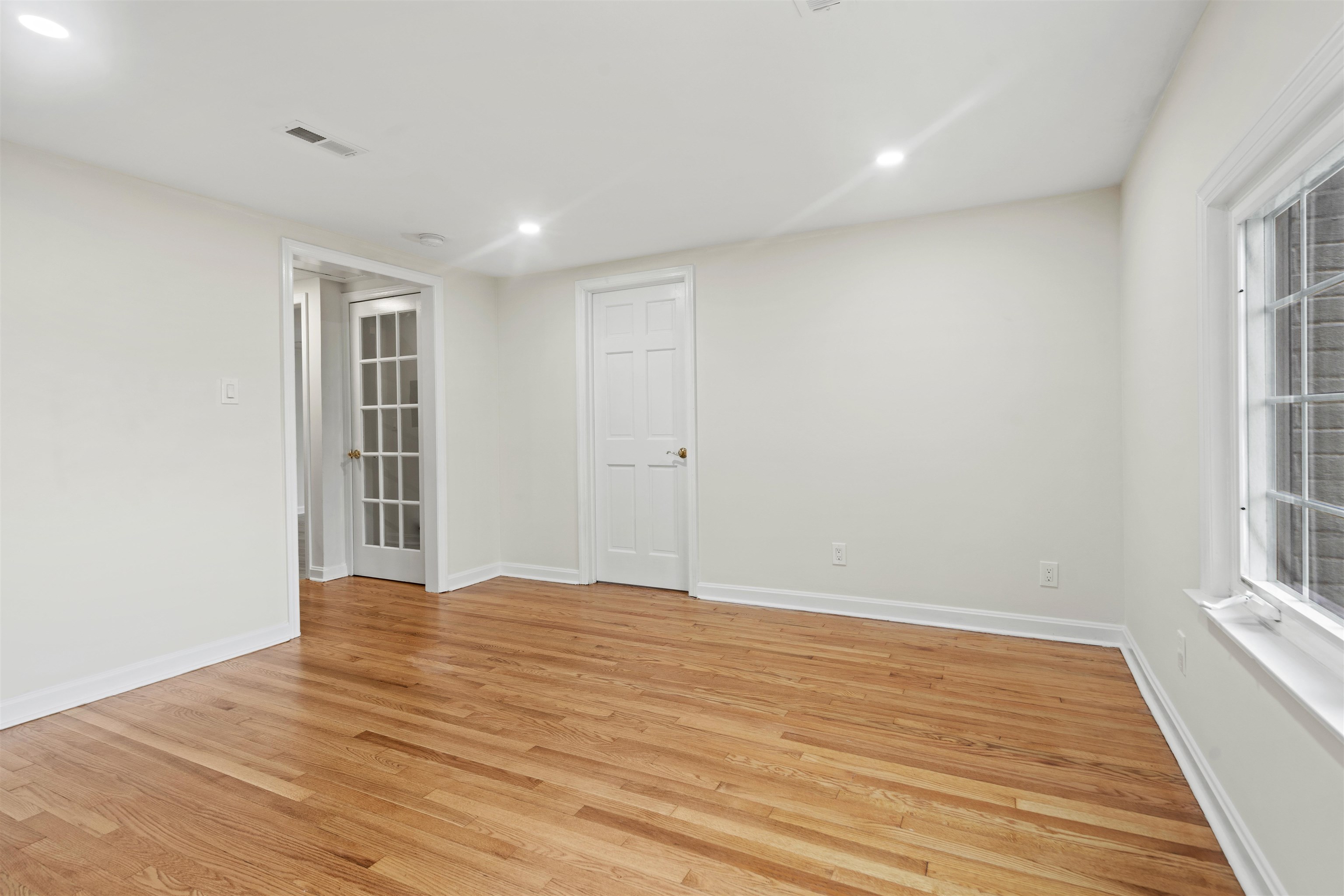 238 Springfield Avenue, Unit 2 Rutherford, NJ 07070 - Photo 5 of 21 wooden floor in an empty room with a window