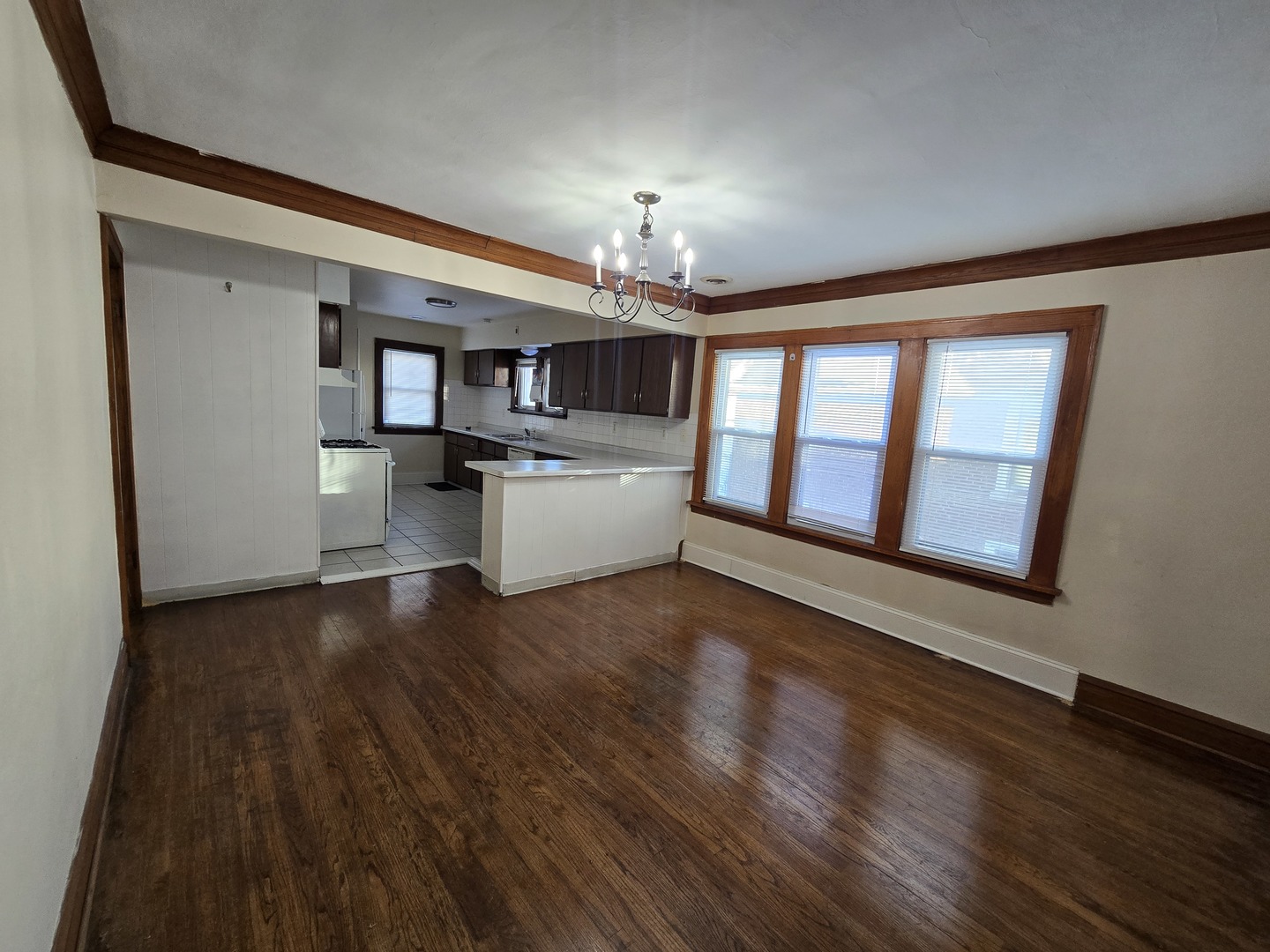 616 West Keith Avenue Waukegan, IL 60085 - Photo 14 of 19 a living room with hard wood floors and kitchen view
