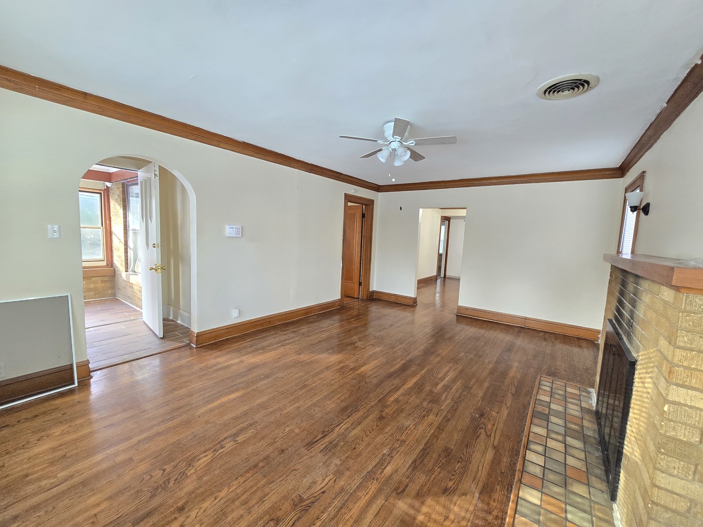 616 West Keith Avenue Waukegan, IL 60085 - Photo 4 of 19 a view of empty room with wooden floor