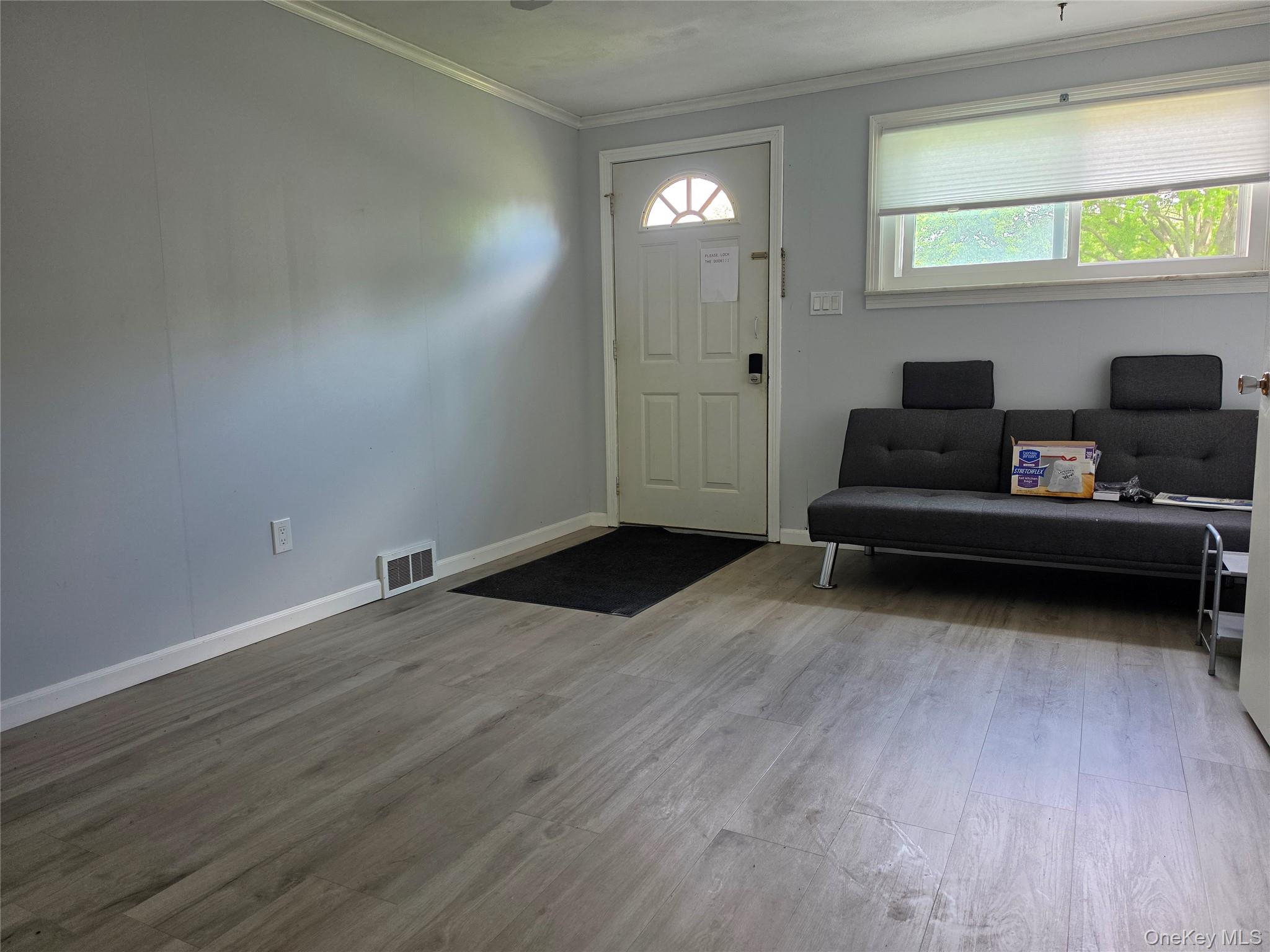 4804 Country Club Road Vestal, NY 13850 - Photo 3 of 15 a living room with furniture and a wooden floor