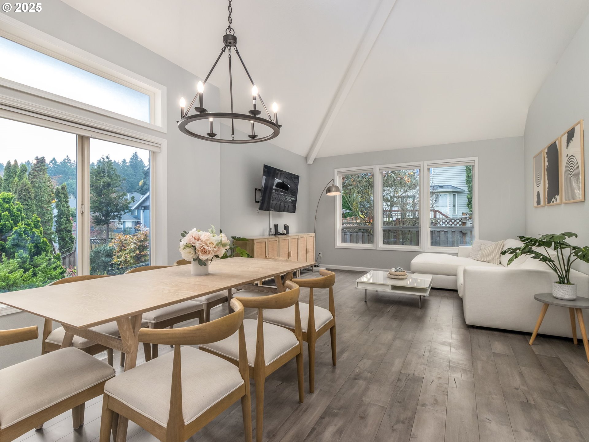 14140 Southwest Chehalem Court Tigard, OR 97223 - Photo 2 of 30 a view of a dining room with furniture wooden floor and chandelier
