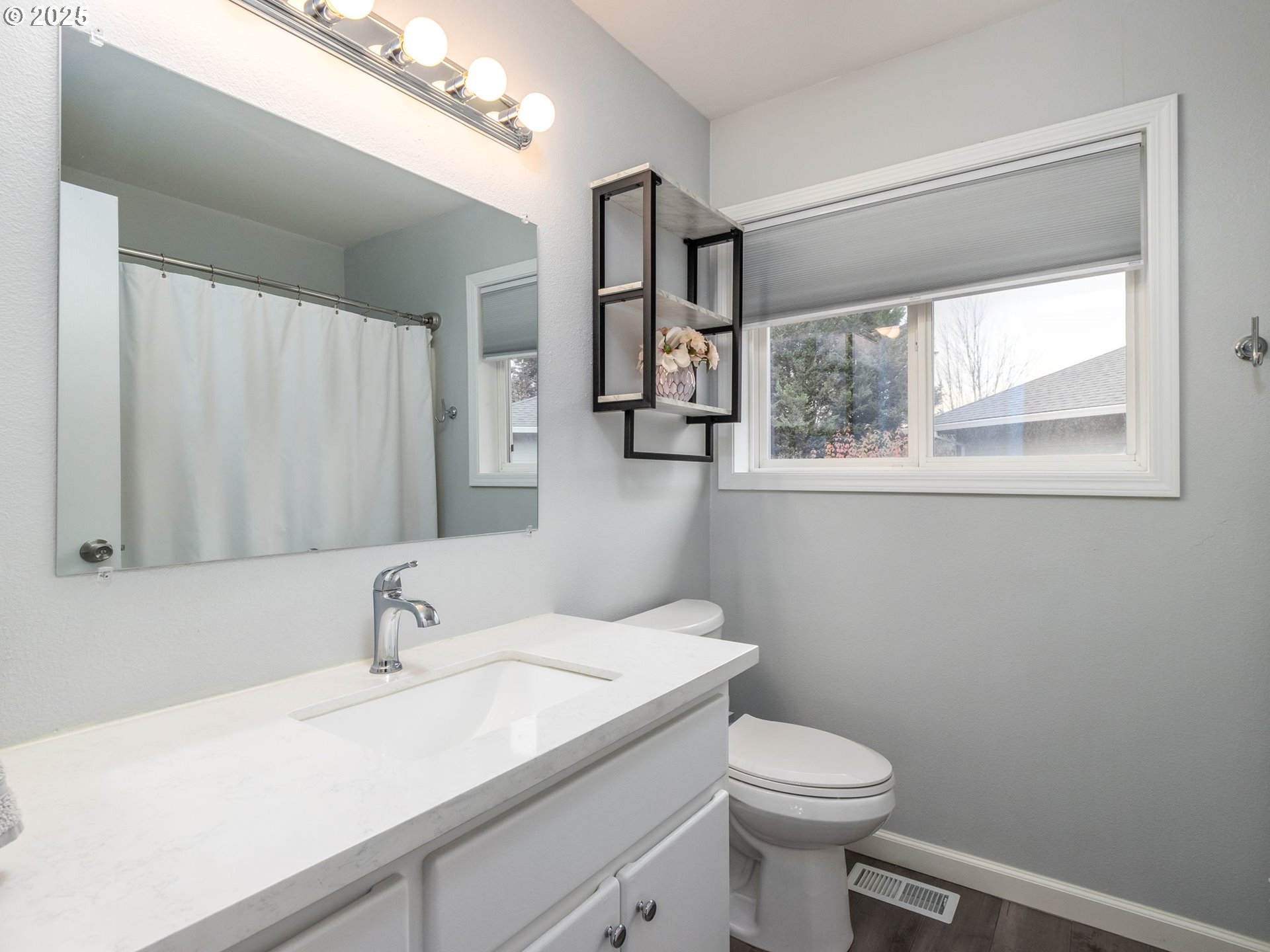 14140 Southwest Chehalem Court Tigard, OR 97223 - Photo 23 of 30 a bathroom with a sink a toilet and a mirror