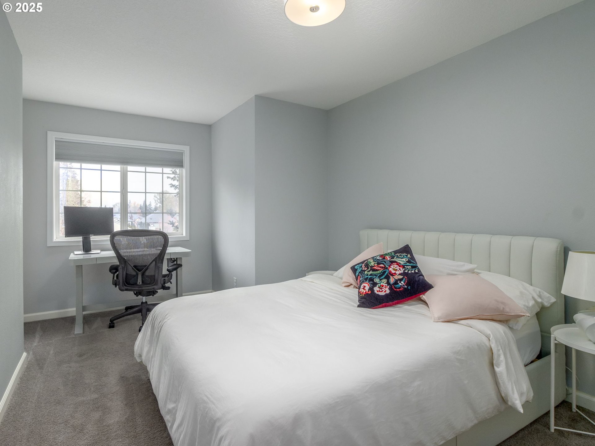 14140 Southwest Chehalem Court Tigard, OR 97223 - Photo 24 of 30 a bedroom with a bed and chair