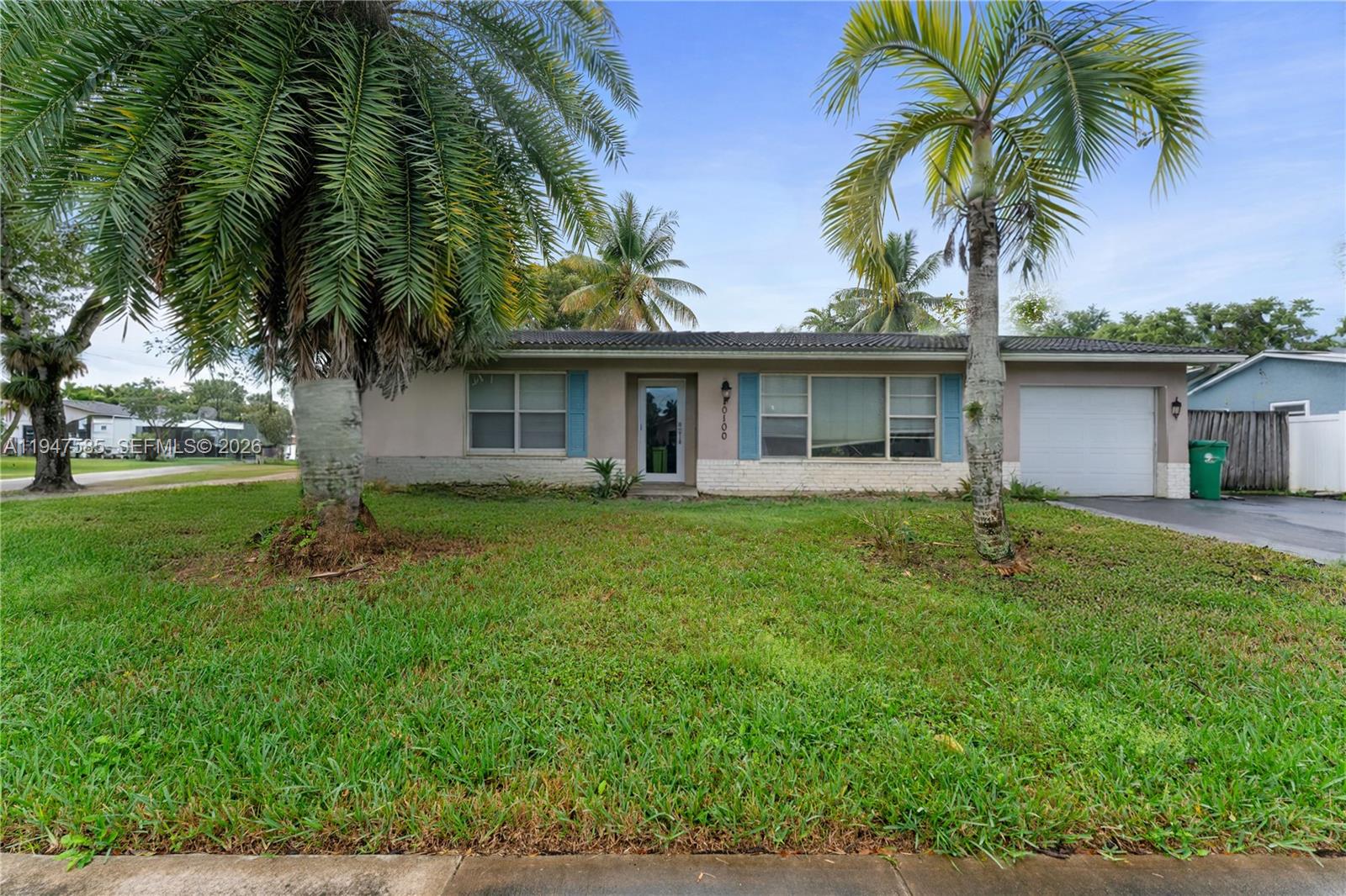 10100 Southwest 50th Court Cooper City, FL 33328 - Photo 2 of 24 a front view of house with yard and green space