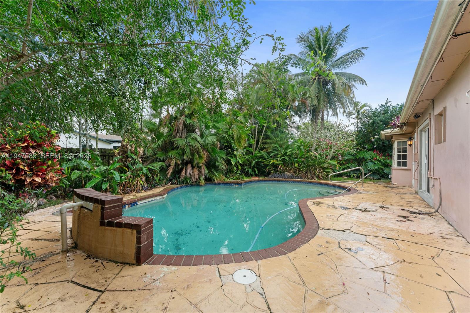 10100 Southwest 50th Court Cooper City, FL 33328 - Photo 23 of 24 a view of a backyard with potted plants