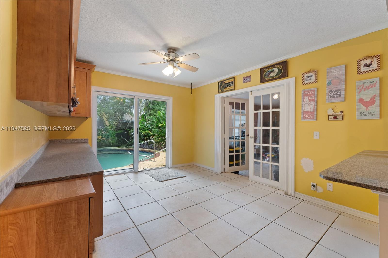 10100 Southwest 50th Court Cooper City, FL 33328 - Photo 9 of 24 a view of an empty room with window and cabinet