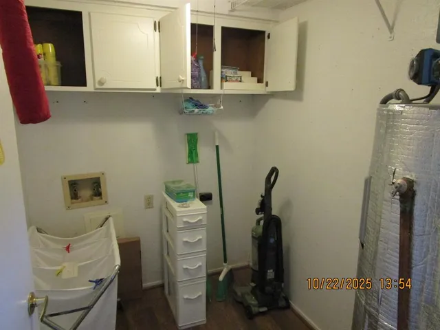 a room with cabinets and wooden floor