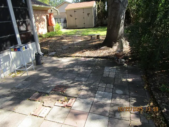 a view of a backyard with pathway