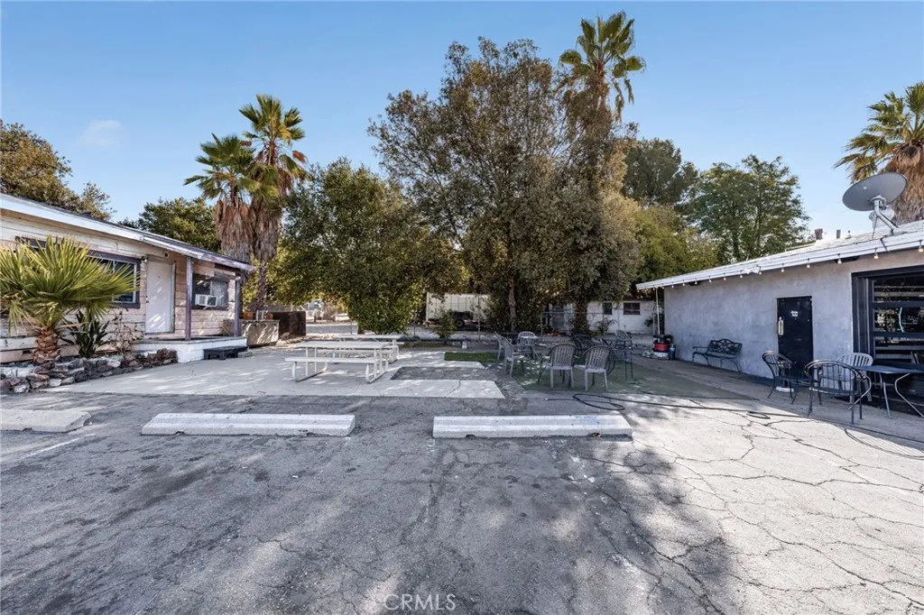 10026 Foothill Boulevard Rancho Cucamonga, CA 91730 - Photo 27 of 34 a view of a house with backyard and a tree
