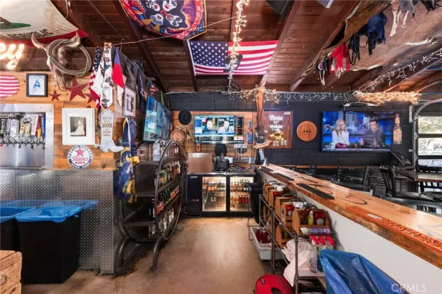 a view of a cafe with sitting area