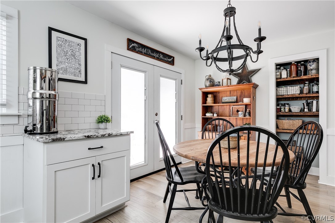 7137 Full Rack Drive Midlothian, VA 23112 - Photo 2 of 4 a view of a dining room with furniture window and wooden floor