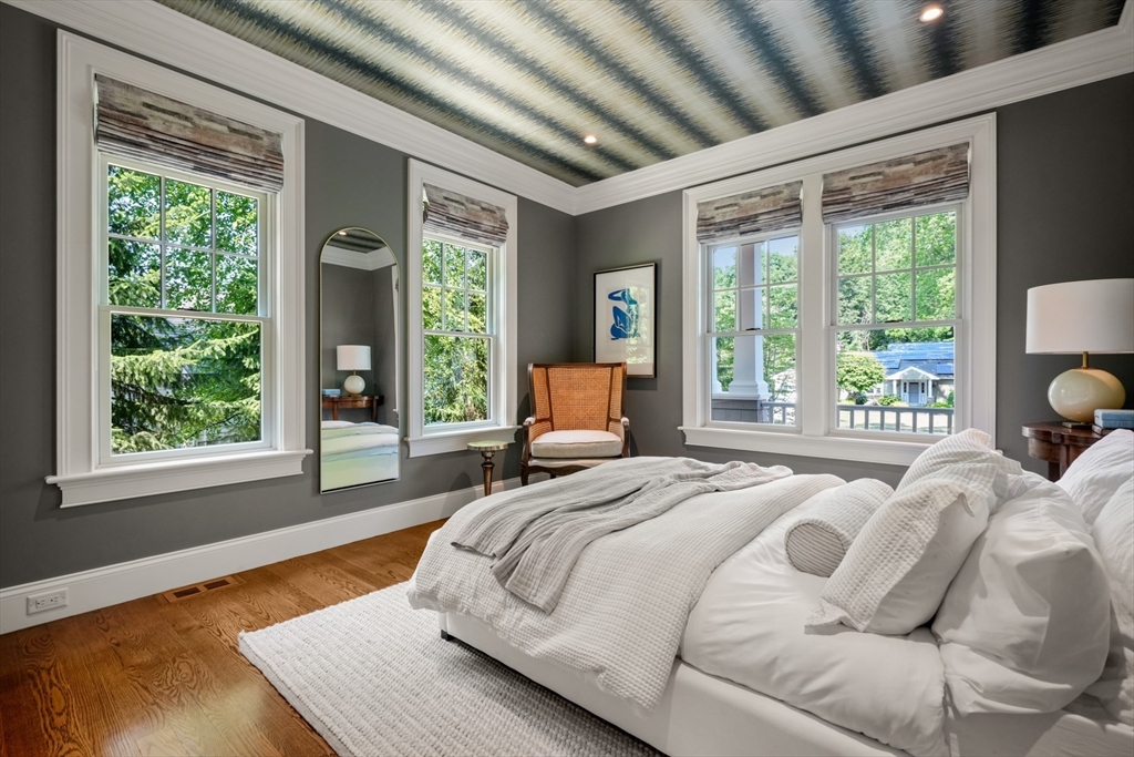 8 Sherburne Road Lexington, MA 02421 - Photo 12 of 35 a bedroom with a bed and large windows