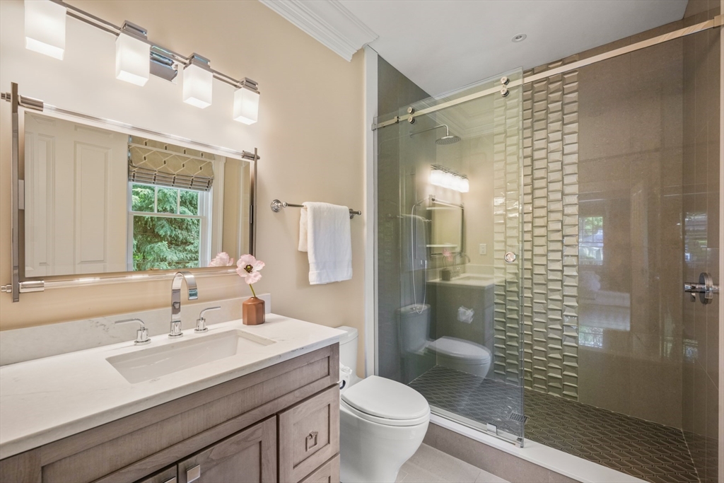 8 Sherburne Road Lexington, MA 02421 - Photo 13 of 35 a bathroom with a sink toilet and shower