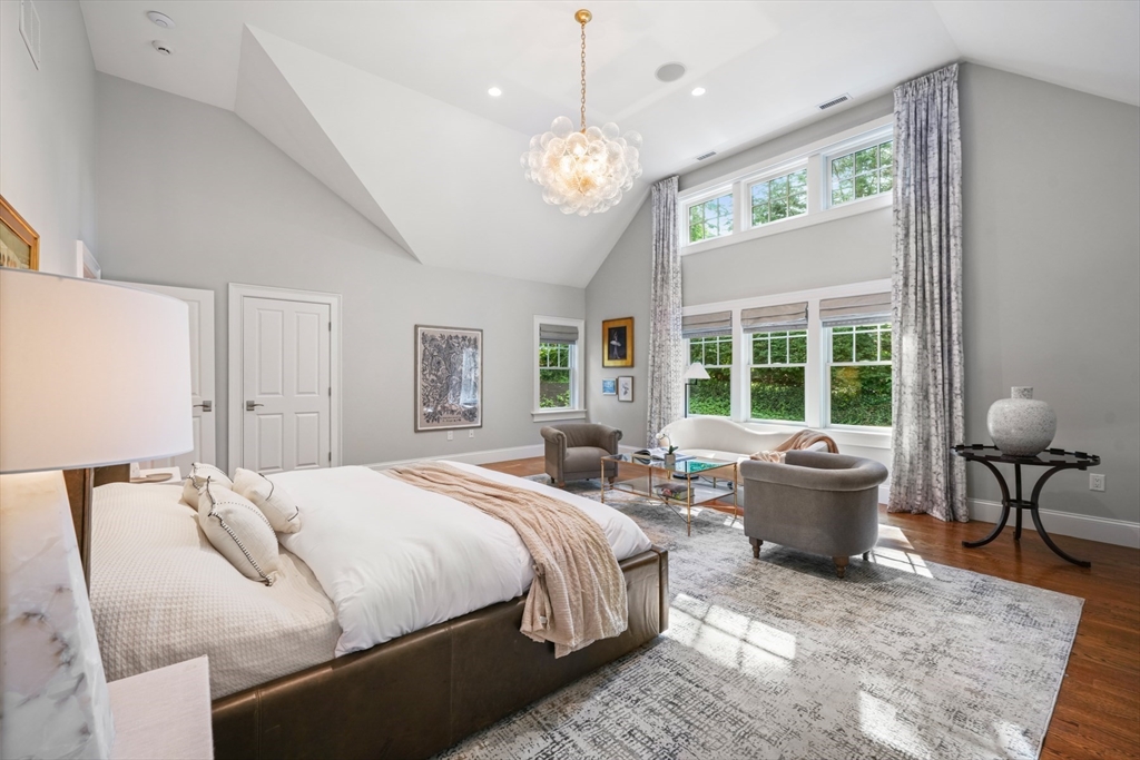 8 Sherburne Road Lexington, MA 02421 - Photo 16 of 35 a spacious bedroom with a bed and a large window