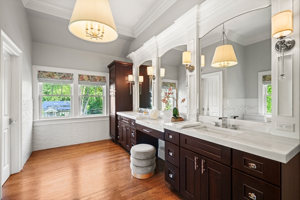 8 Sherburne Road Lexington, MA 02421 - Photo 18 of 35 a bathroom with a sink and a large mirror