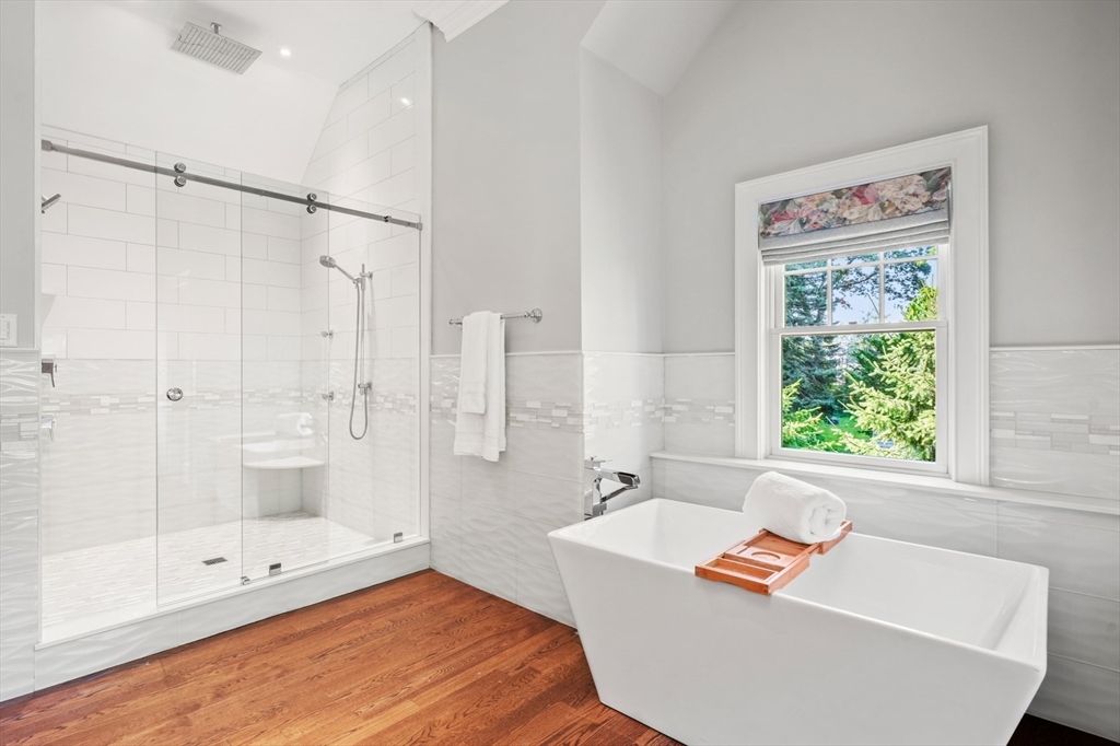 8 Sherburne Road Lexington, MA 02421 - Photo 19 of 35 a bath room with a bath tub and a shower
