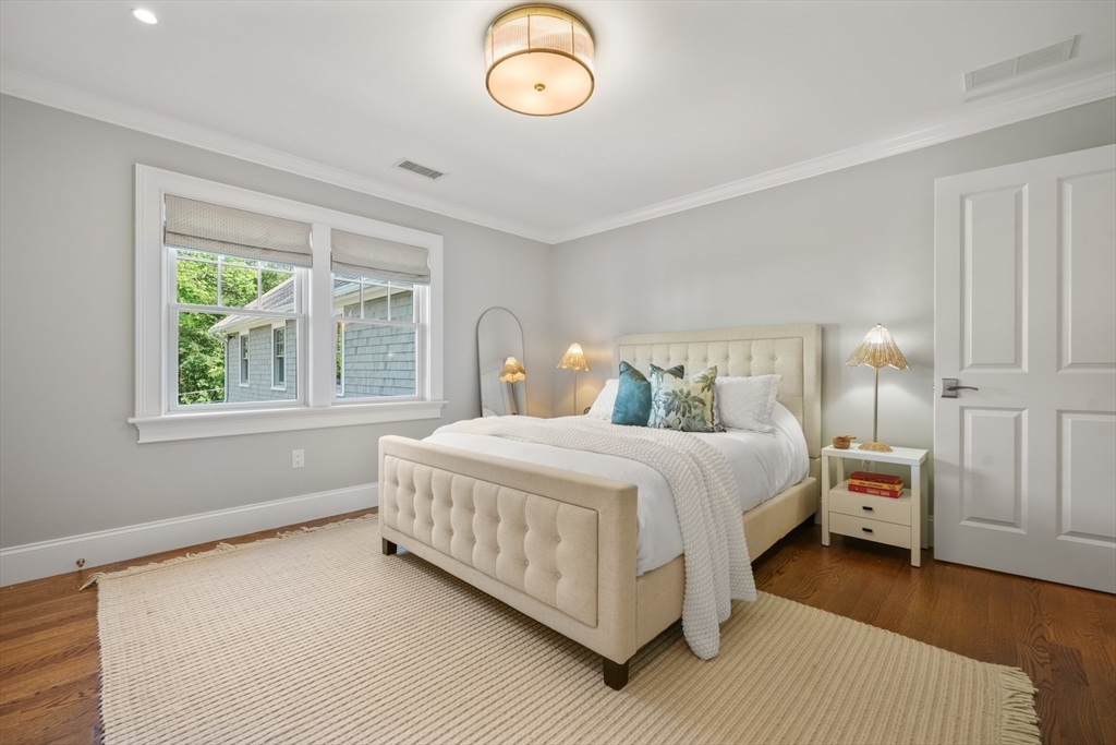 8 Sherburne Road Lexington, MA 02421 - Photo 20 of 35 a bedroom with a bed and window