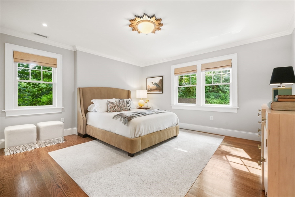 8 Sherburne Road Lexington, MA 02421 - Photo 21 of 35 a spacious bedroom with a bed and a couch