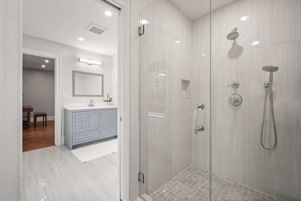8 Sherburne Road Lexington, MA 02421 - Photo 25 of 35 a bathroom with a shower and a sink