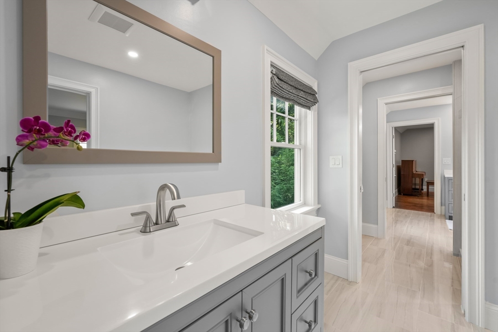 8 Sherburne Road Lexington, MA 02421 - Photo 26 of 35 a bathroom with a sink and a mirror
