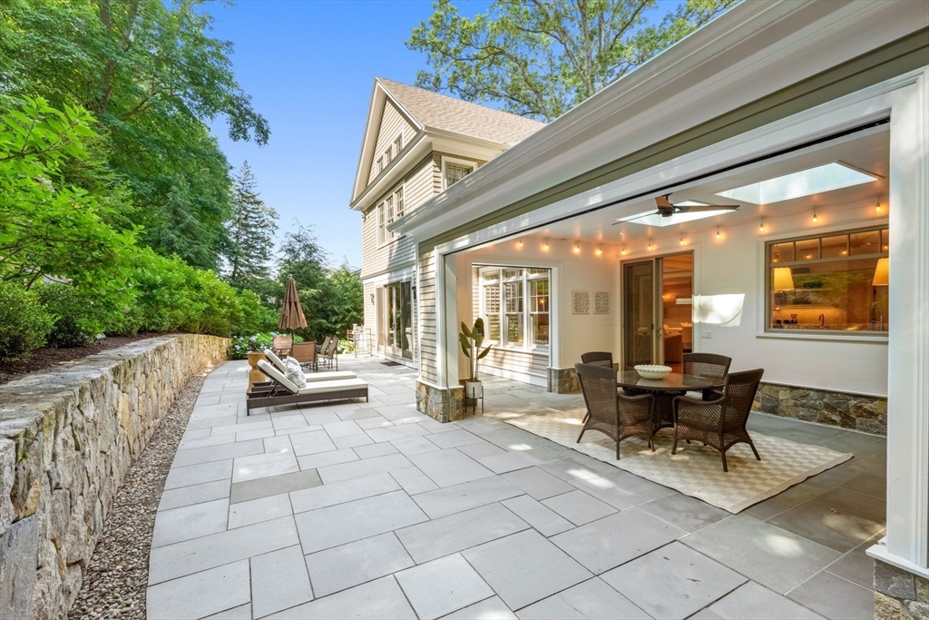 8 Sherburne Road Lexington, MA 02421 - Photo 28 of 35 a view of a patio with chairs and tables
