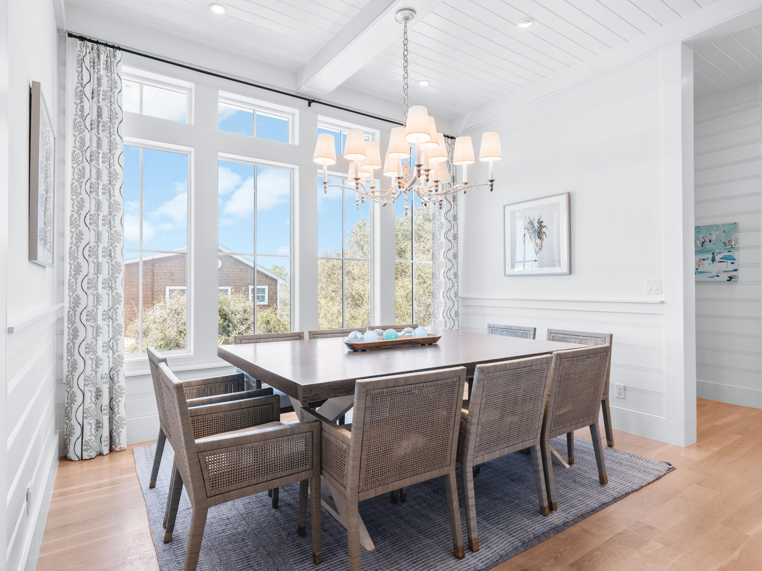 178 Pompano Street Inlet Beach, FL 32461 - Photo 33 of 49 a dining room with a wooden table and chairs