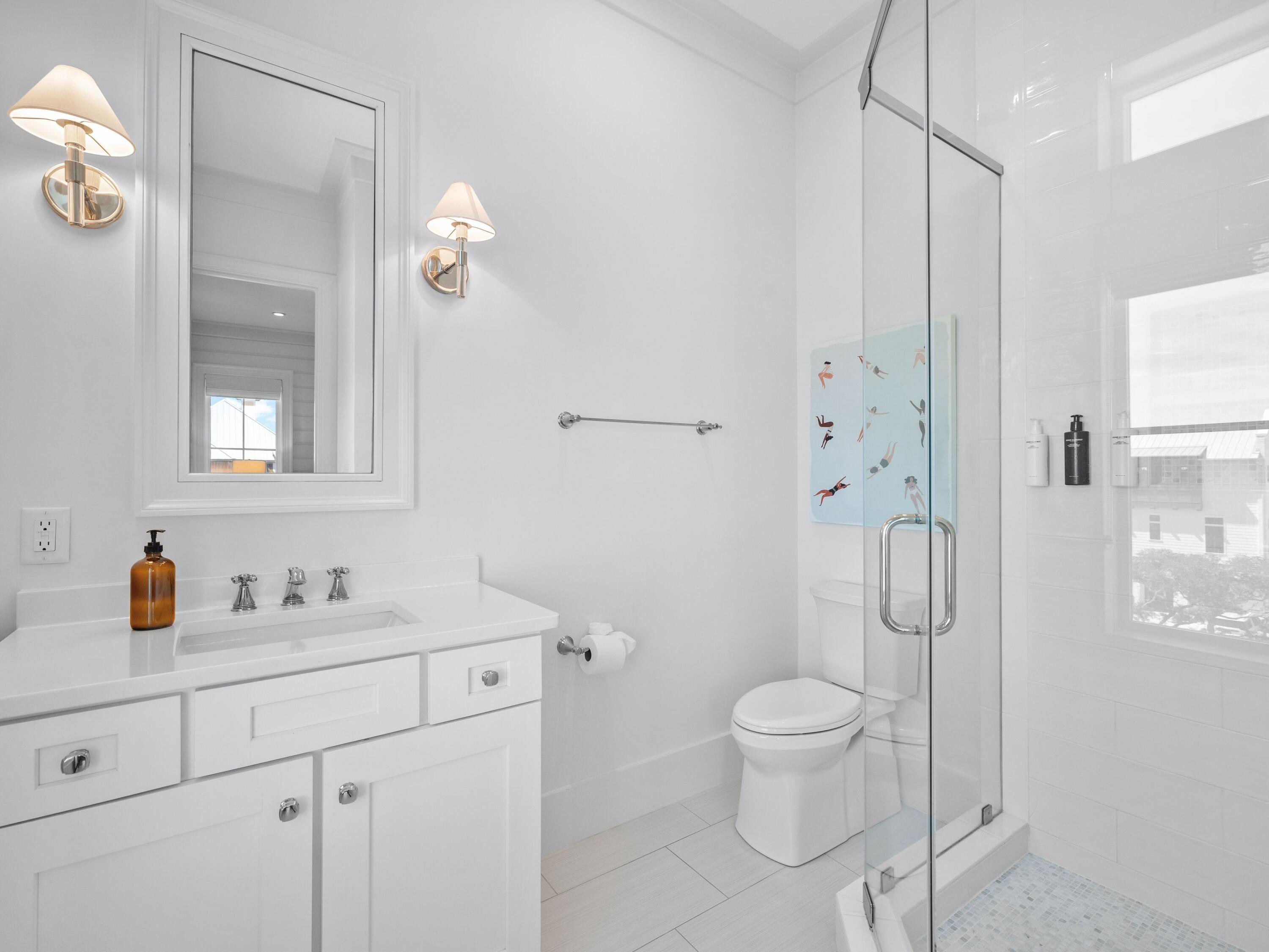 178 Pompano Street Inlet Beach, FL 32461 - Photo 42 of 49 a bathroom with a toilet sink a mirror and shower