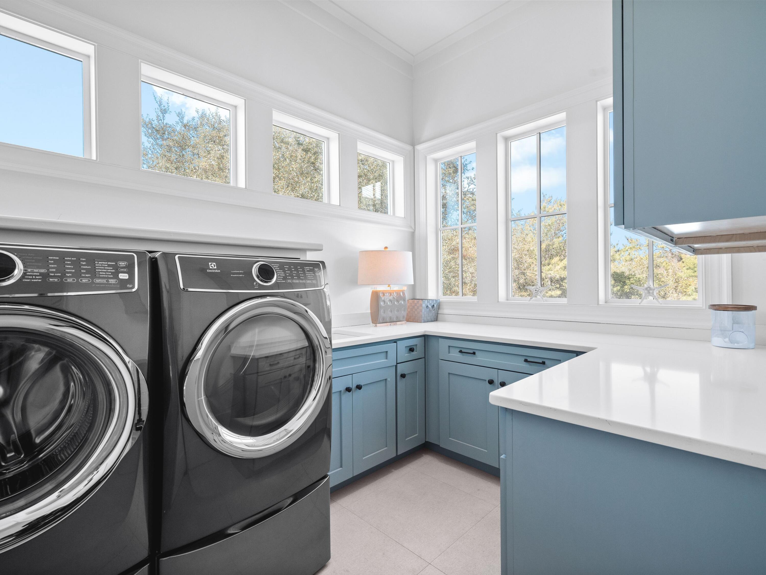 178 Pompano Street Inlet Beach, FL 32461 - Photo 43 of 49 a utility room with sink dryer and washer