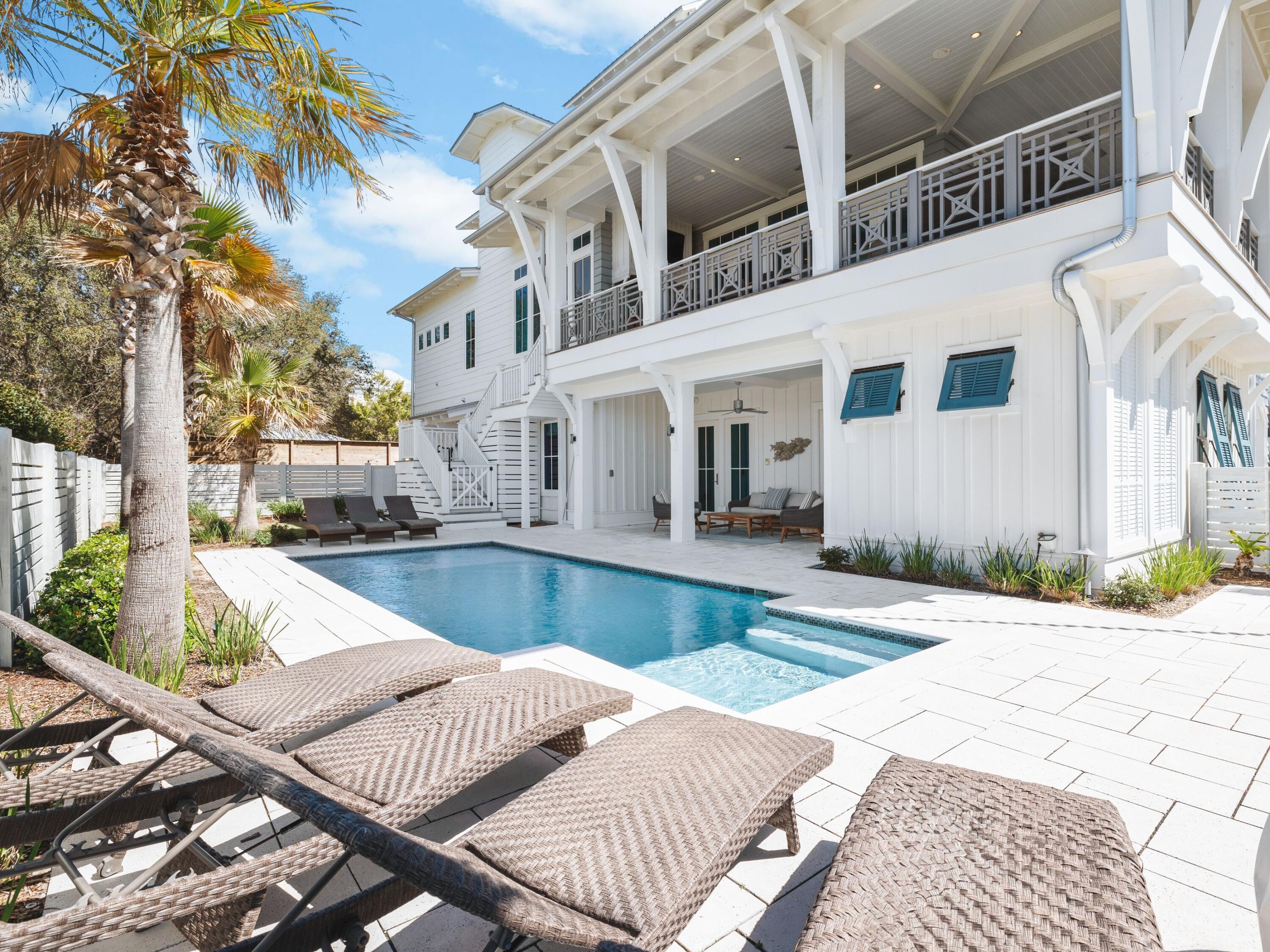 178 Pompano Street Inlet Beach, FL 32461 - Photo 9 of 49 a view of a white building with a swimming pool