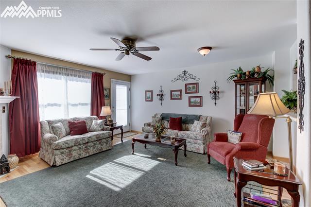 3639 Indigo Ridge Point Colorado Springs, CO 80910 - Photo 8 of 17 Spacious living room with walk out to deck!