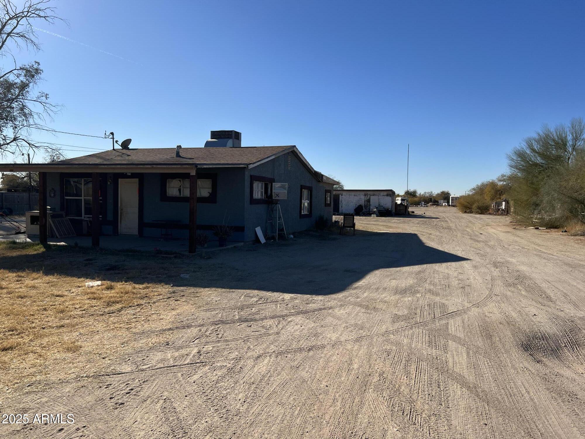 218 North Apache Road Buckeye, AZ 85326 - Photo 7 of 9 Front View 2025Jan2