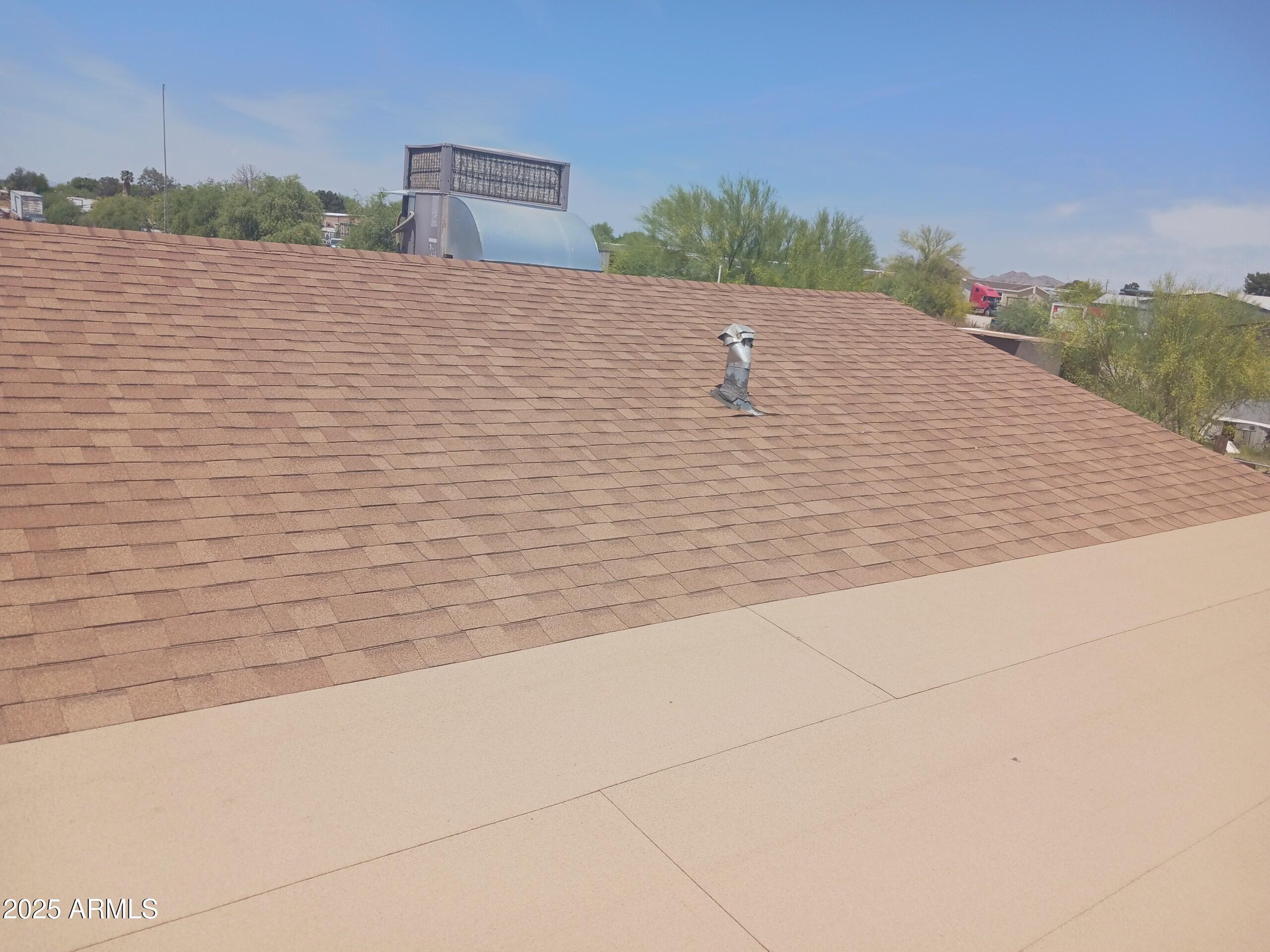 218 North Apache Road Buckeye, AZ 85326 - Photo 9 of 9 218 Apache Roof 2023May2