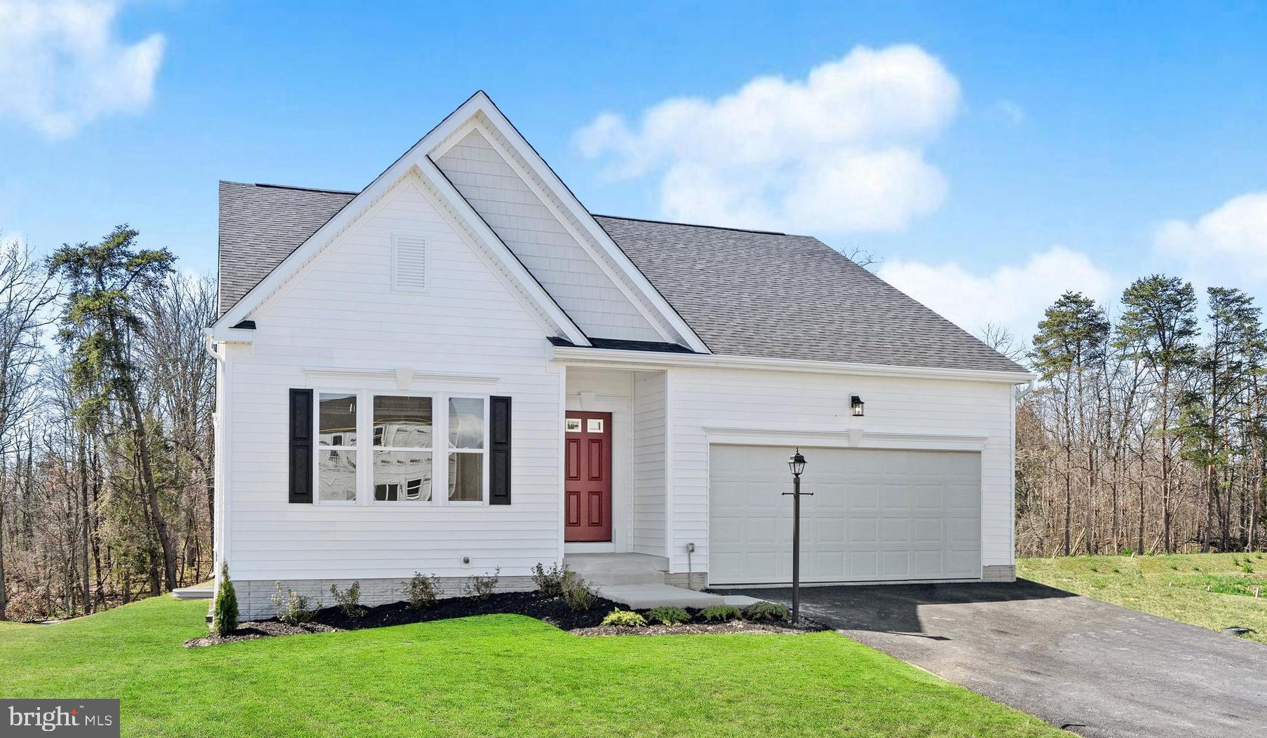 a view of front of house with a yard