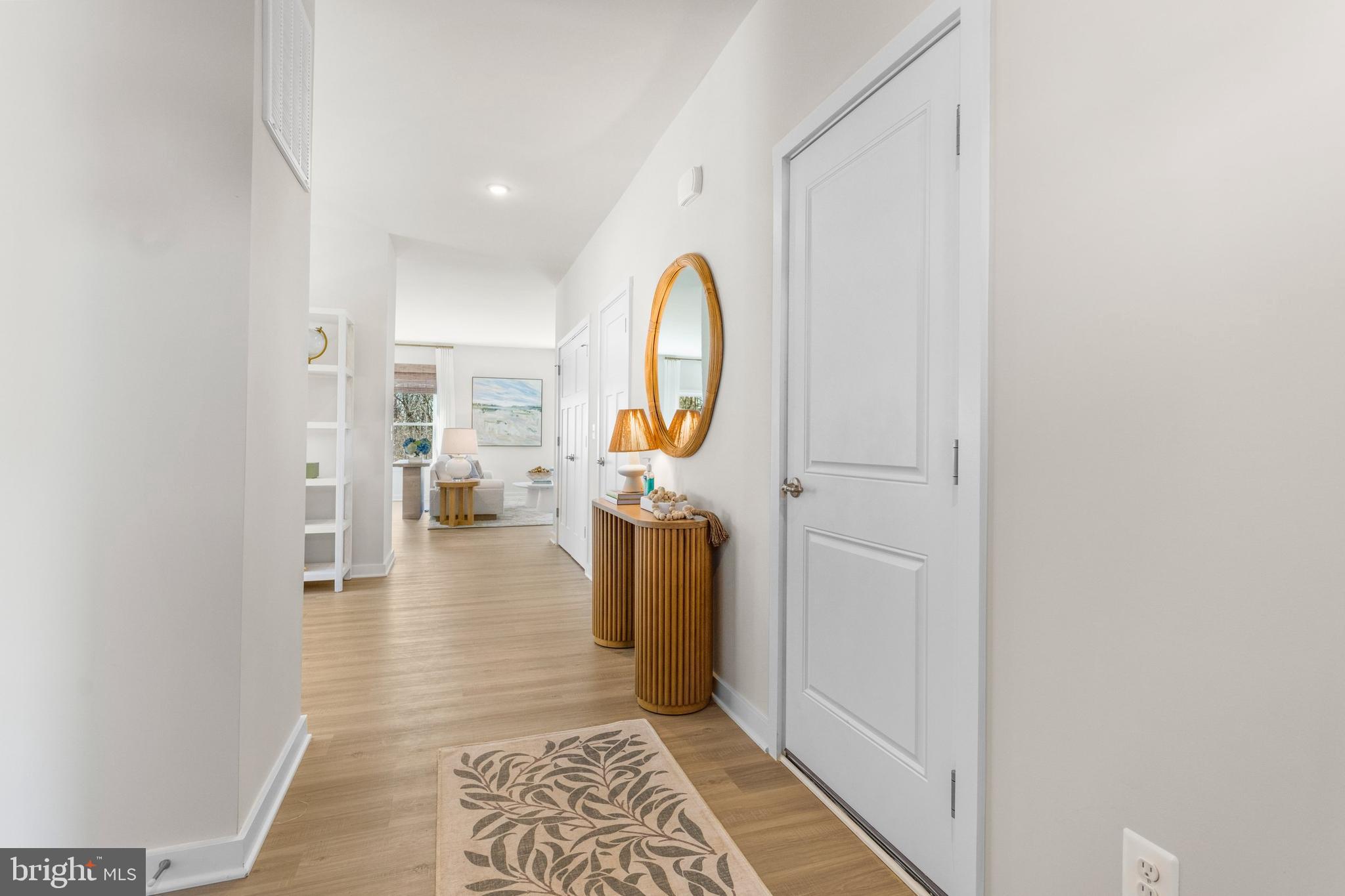 25 Williamson Road Winchester, VA 22602 - Photo 11 of 22 a view of a hallway with wooden floor and a bathroom